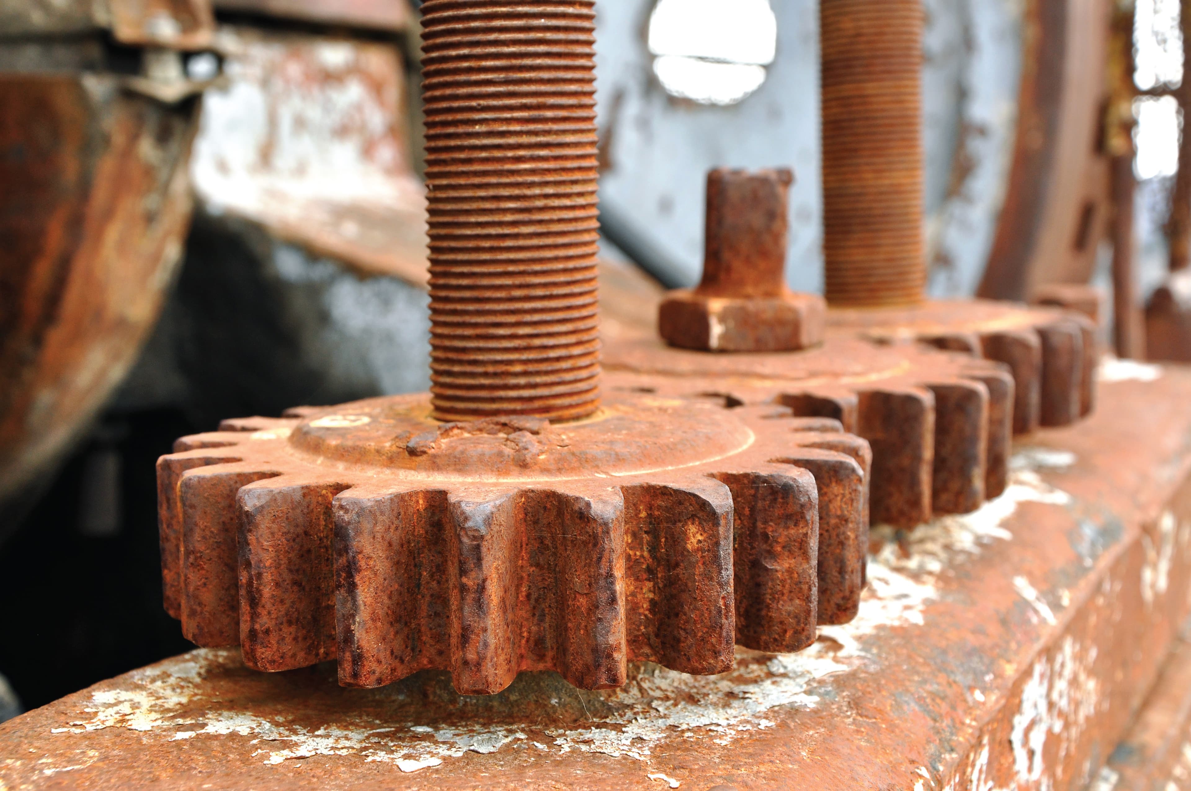 Heavily rusted industrial gears — maintenance and restoration context